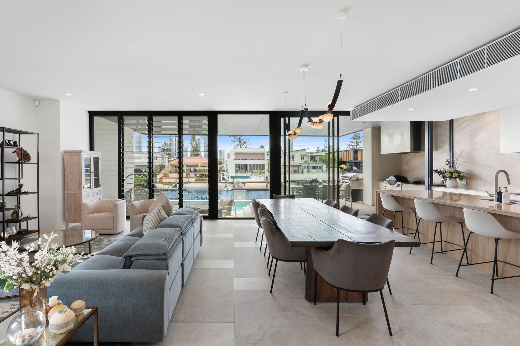 Open-plan living and dining looking through to the waterfront