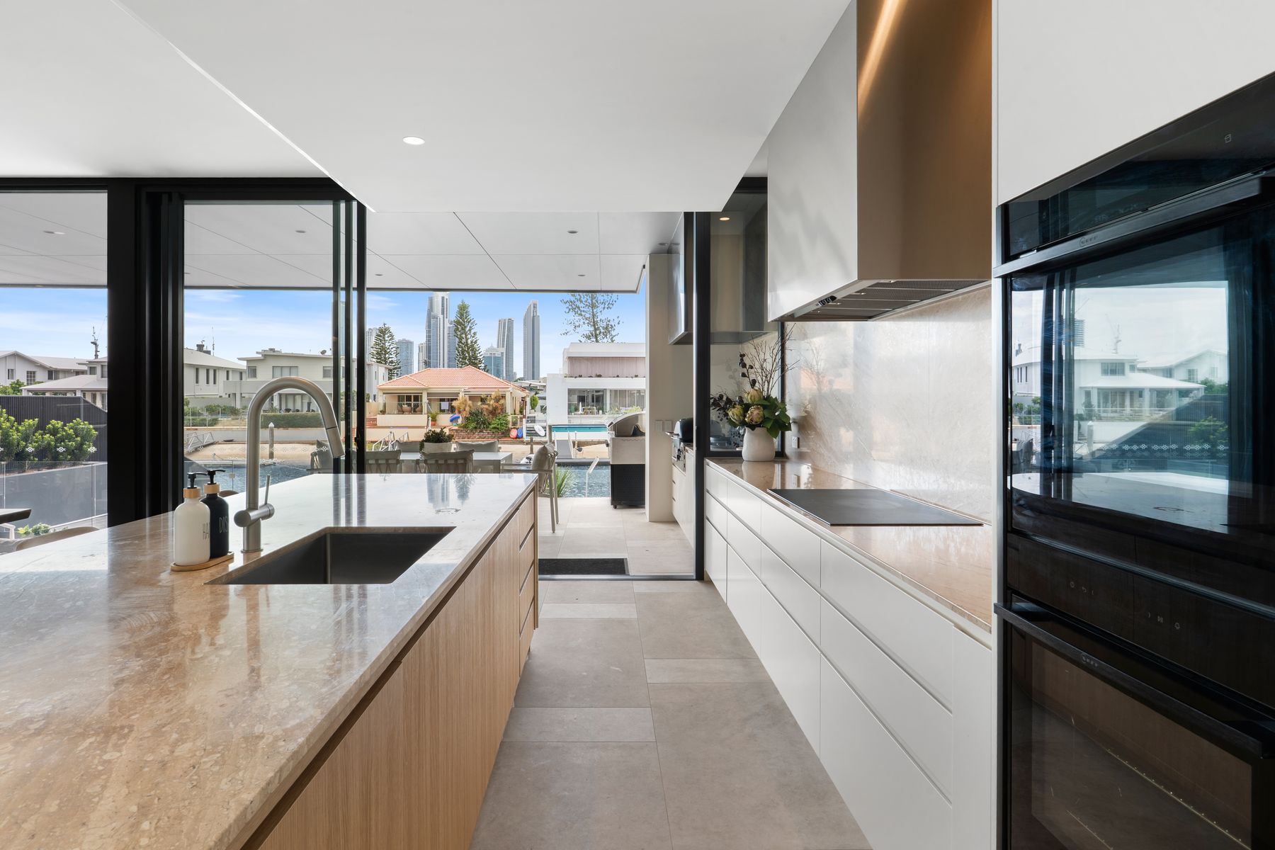 Kitchen island and cooktop looking out to the waterfront